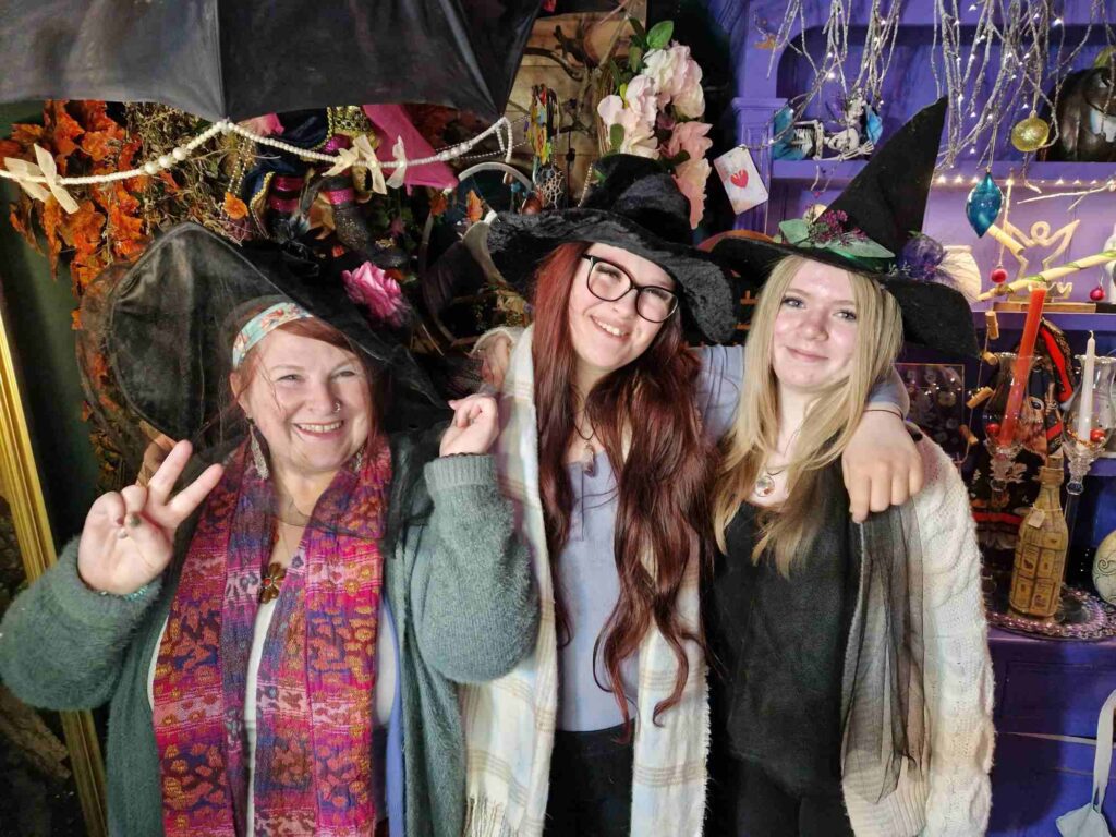 Ladies from Hippy Wytch wearing witches hats