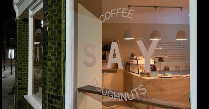 SAY Doughnuts shopfront with heritage tile frontage, pale pink lettering on glass windows