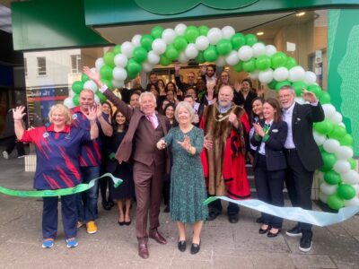 Mayor Tom Wootton celebrates re-opening of Specsavers in the Harpur Centre
