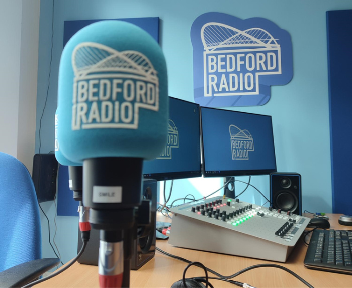 A blue microphone with Bedford Radio on it.