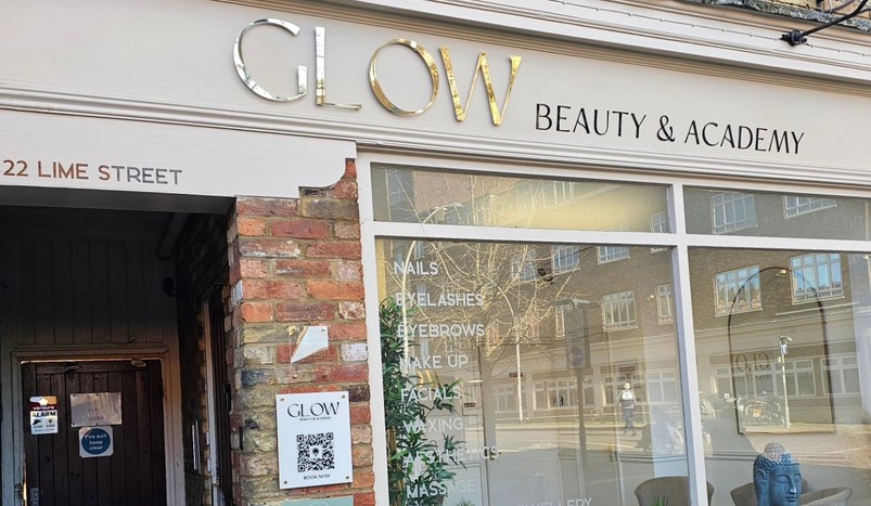Glow Beauty shopfront cream fascia and windows with gold Glow word