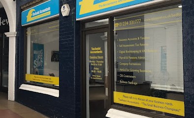 Tax Assist shopfront with black timberwork and blue and yellow sign