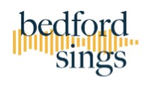 Bedford Sings yellow piano keys with blue writing