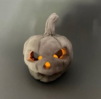 Higgins Bedford clay pumpkin skull with candles