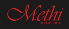 Methi logo red writing on black background