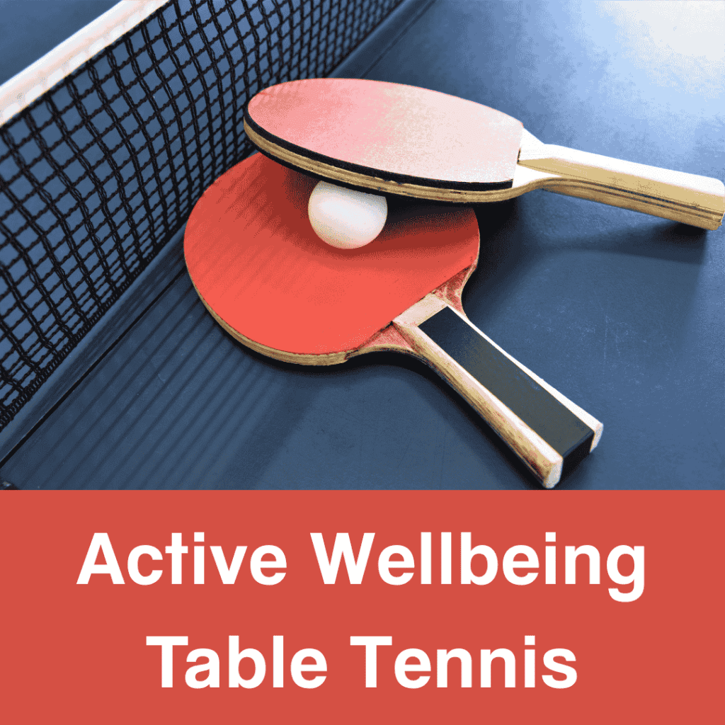 Red table tennis rackets with a ping pong ball on a blue table.